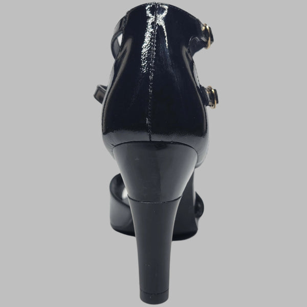 Black heeled women's shoe back view. Featuring shock-absorbing heel and buckled strap for a comfortable wear.