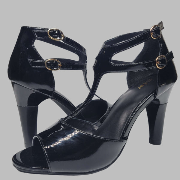 Black heeled women's shoe pair view. Featuring shock-absorbing heel and buckled strap for a comfortable wear.